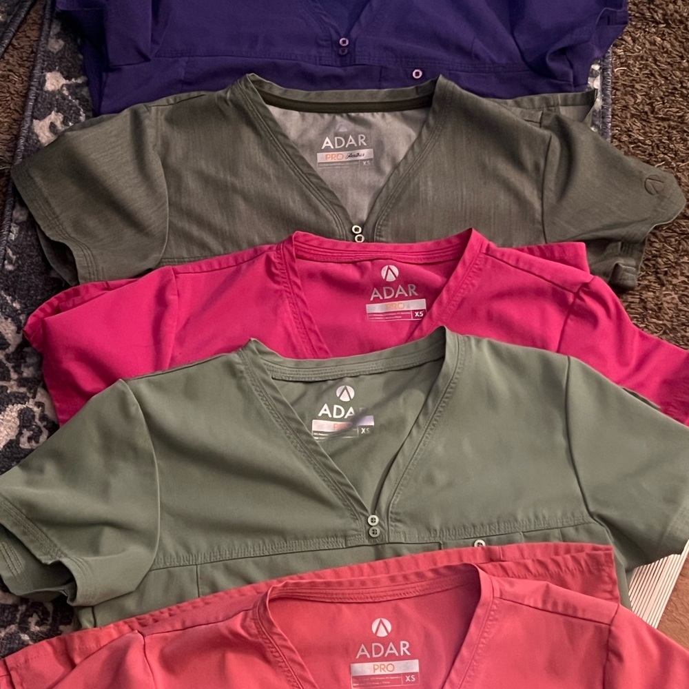 Xsmall Adar scrub tops. Grape, heather olive, fruit punch, spring leaf & coral.